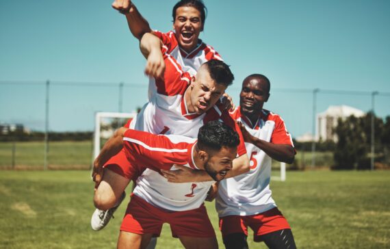Soccer player, soccer and soccer field, winner and team, diversity and celebrate goal, athlete happ